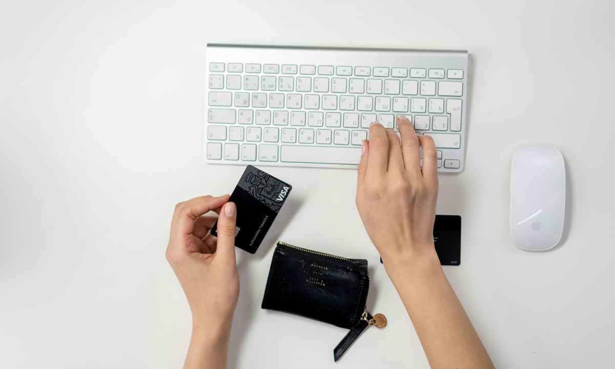 a person paying for something online with a credit card