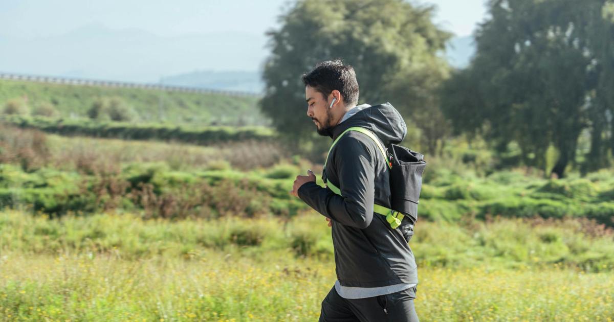 Man jogging briskly outdoors