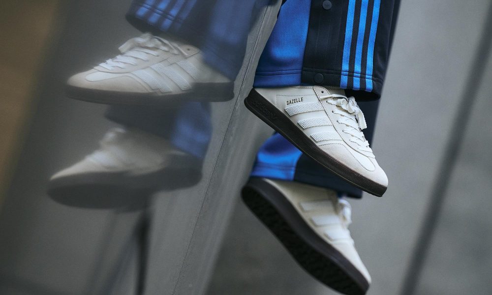 model wearing white gazelle sneakers