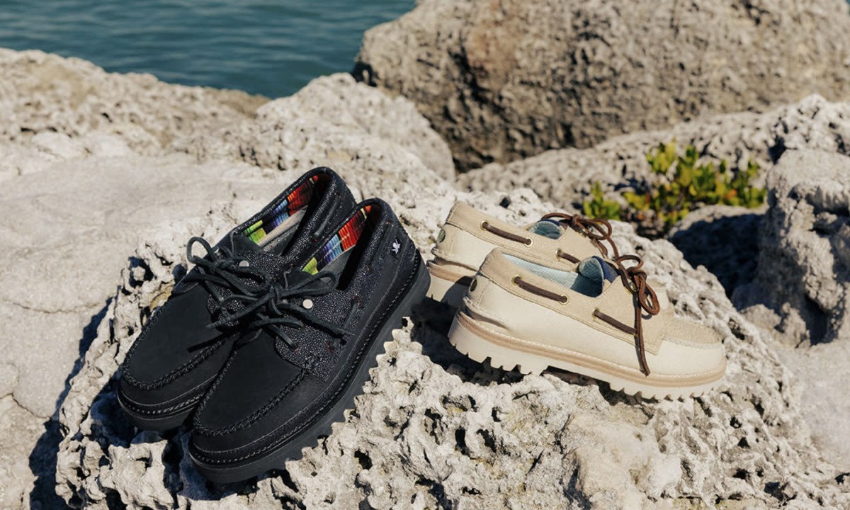 black and beige boat shoes on dirt