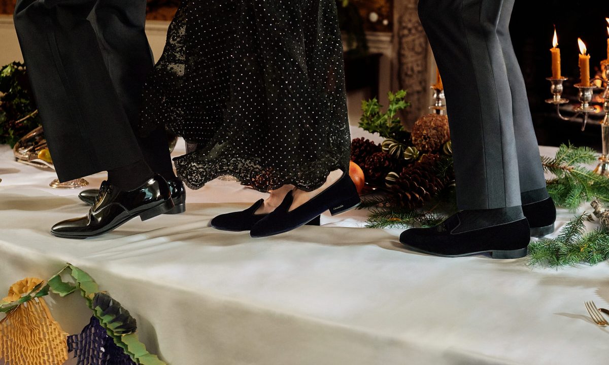 three people wearing Church's shoes on top of table