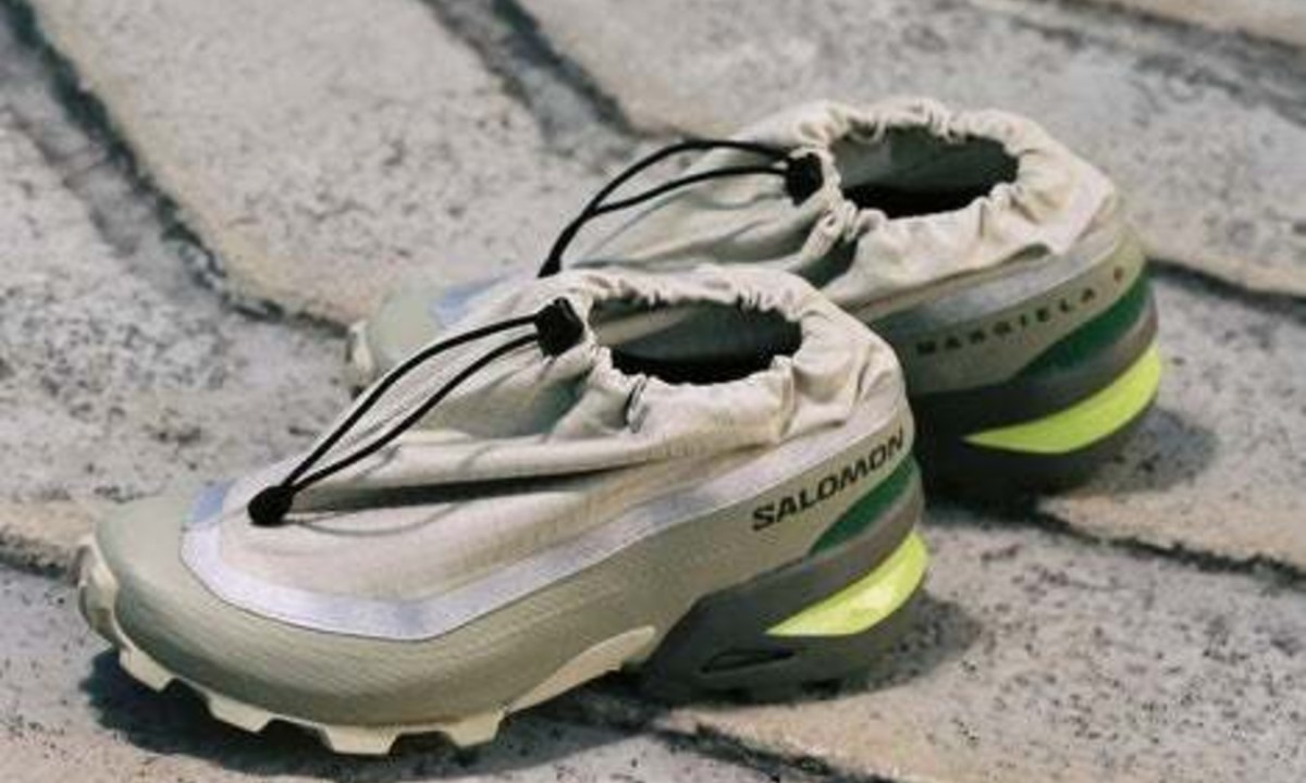 silver and green sneakers on concrete