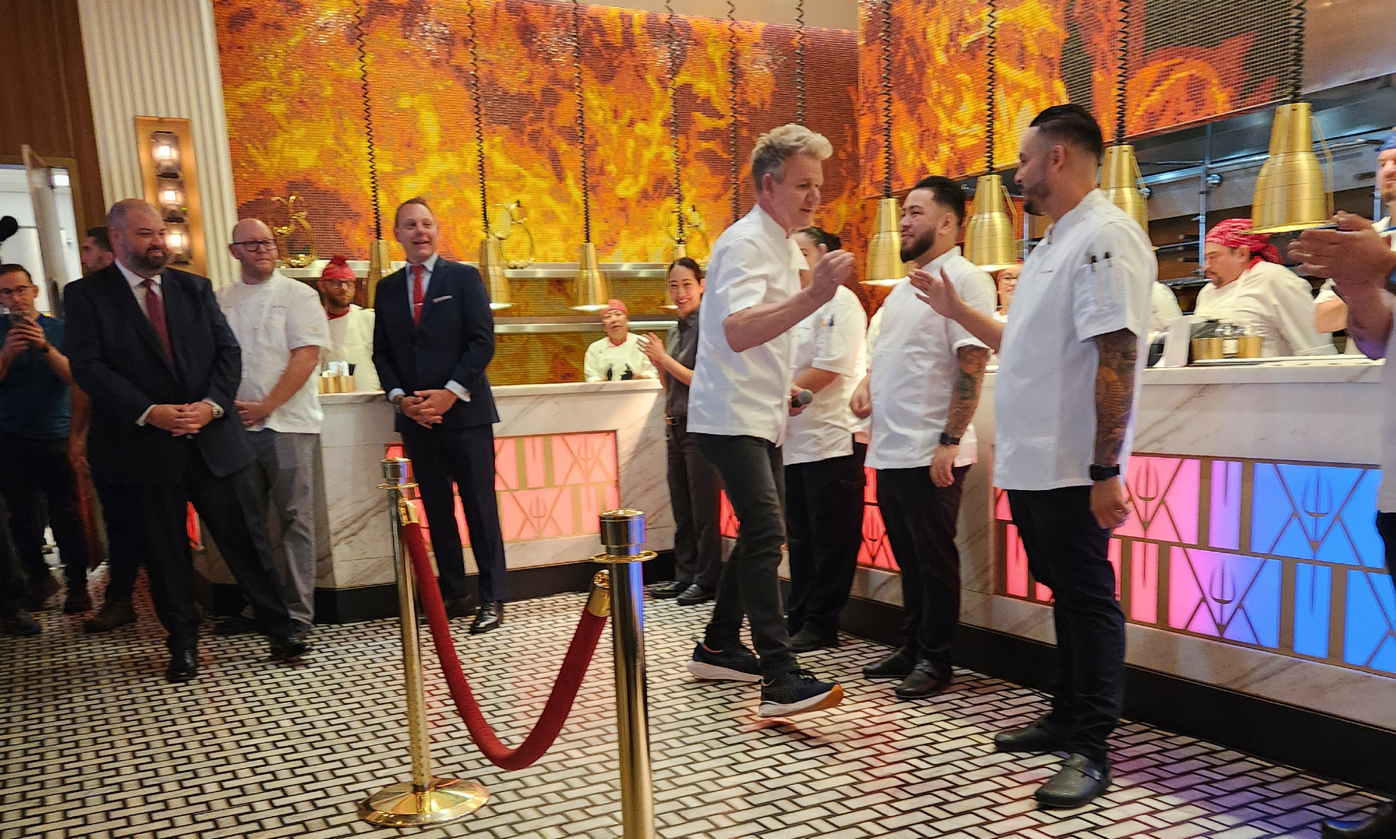 Trackside Lunch with Gordon Ramsay - Gordon Ramsay enters saying hello to his crew.