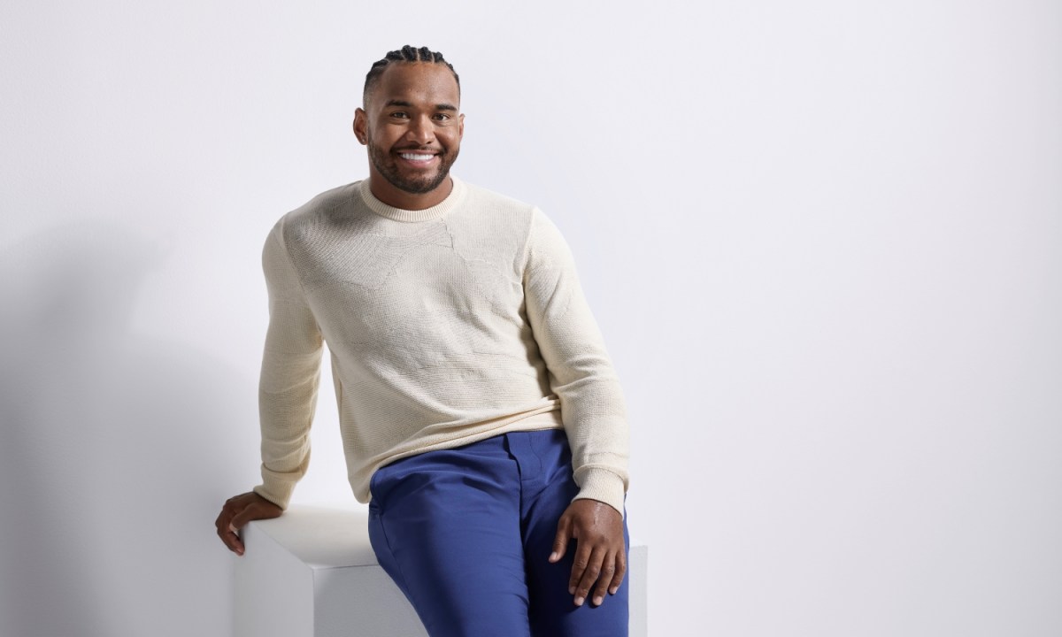 Tua Tagovailoa in a Perry Ellis sweater