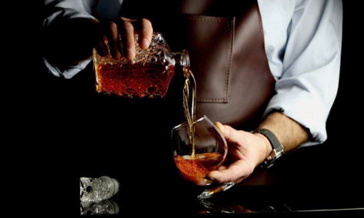 Pouring whiskey in a glass