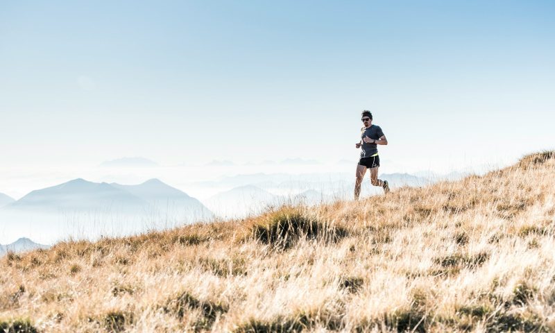 man running on mountain outside