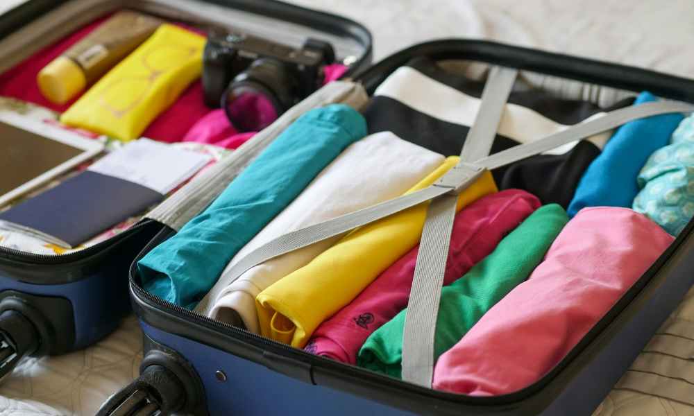 Open suitcase with clothes packed