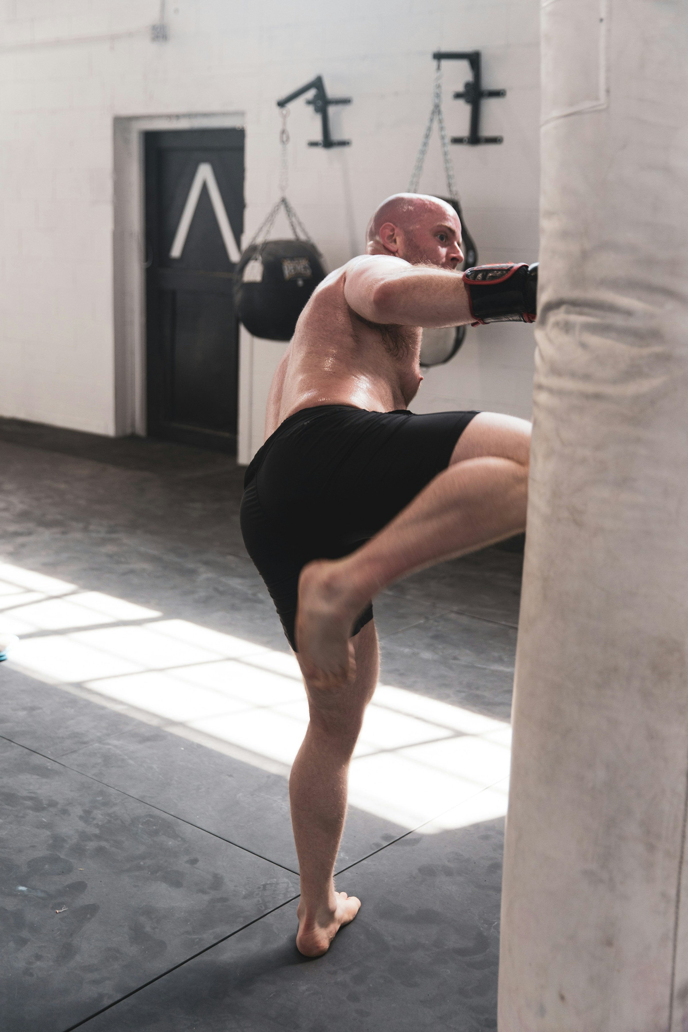man boxing shirtless gym boxing gloves