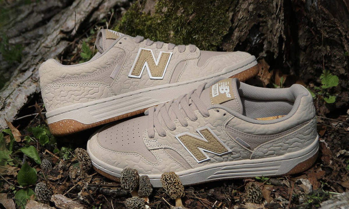 new balance sneakers on dirt and leaves
