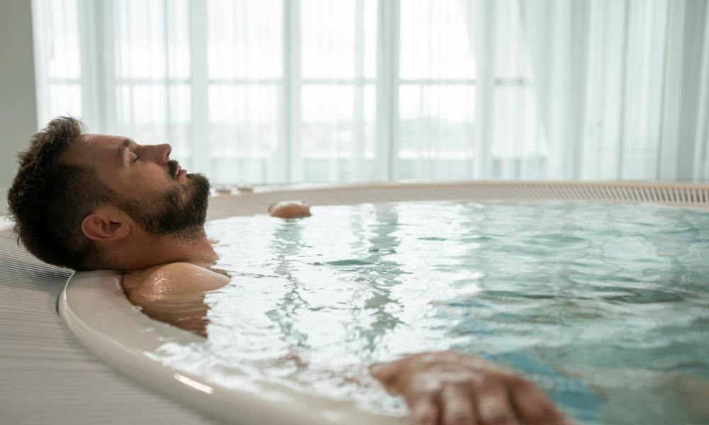 man hot tub relax indoors