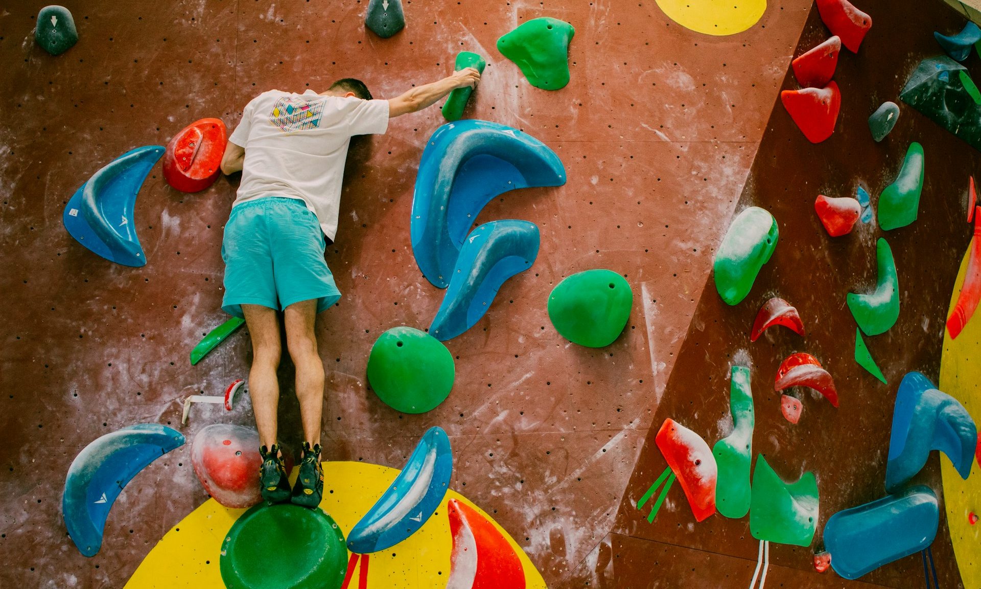 Man bouldering at a gym