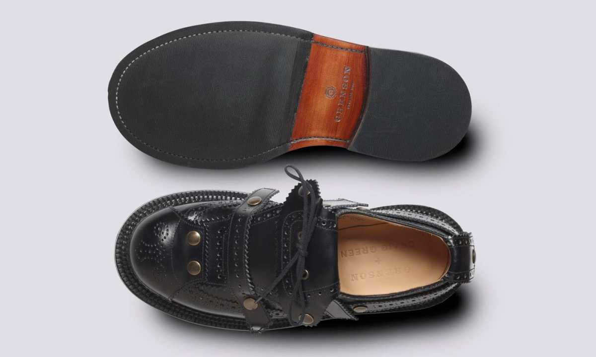black leather oxford brogues one on top and one turned over