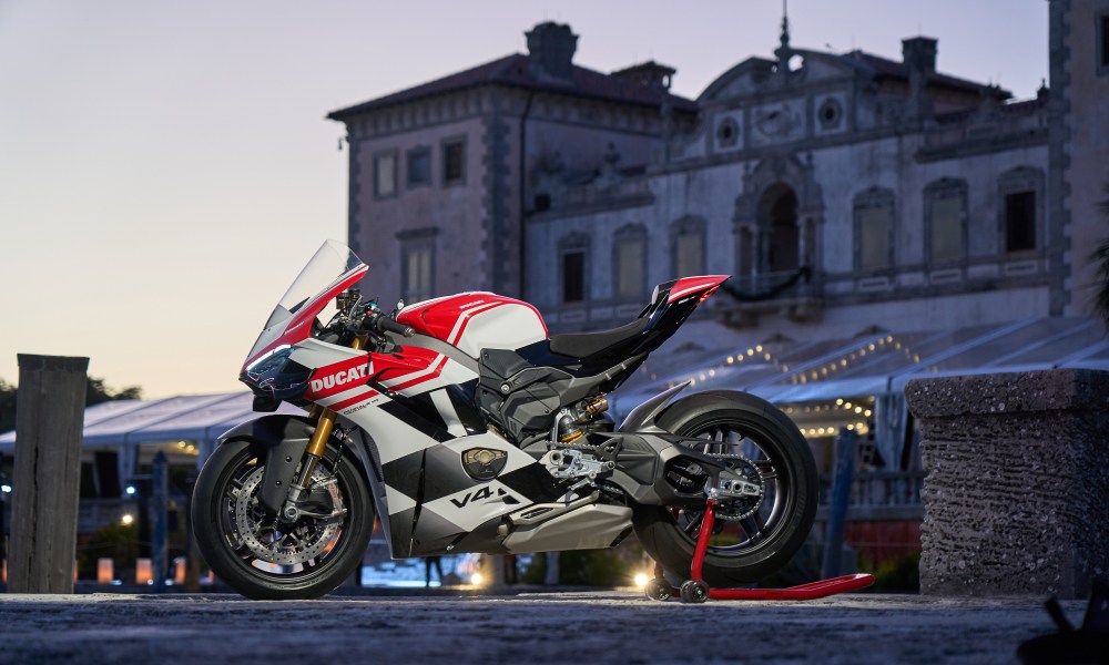 2024 Ducati Panigale V4 Tricolore limited edition parked in a plaza, left profile view.