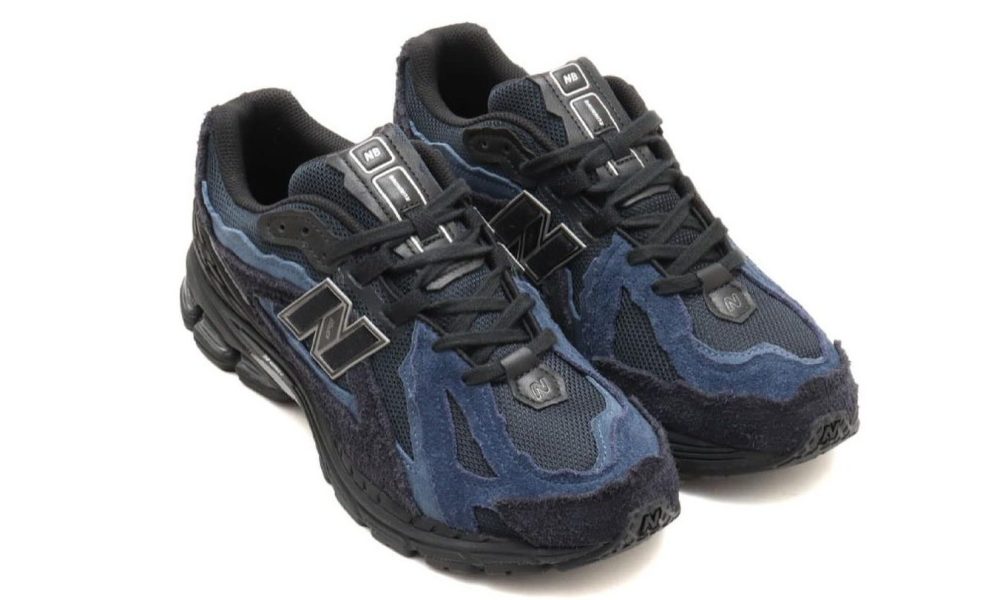 navy blue and black sneakers against white background