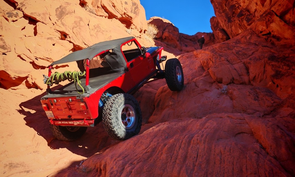 Jeep rock crawling over boulders