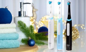 Three units of the Oral-B iO Series 3 Limited electric toothbrush in the bathroom.