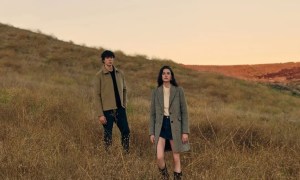 Paige couple on a grassy hill