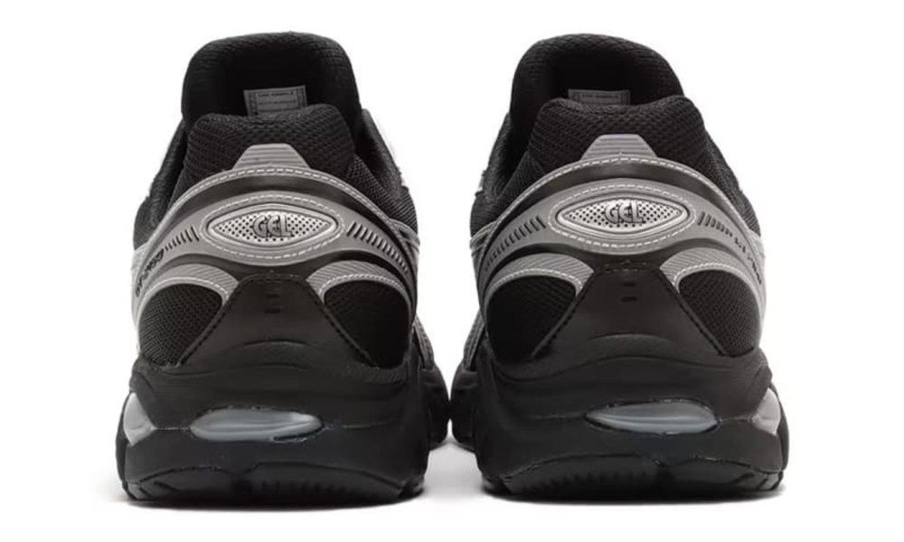 close up on heels of black and grey sneaker