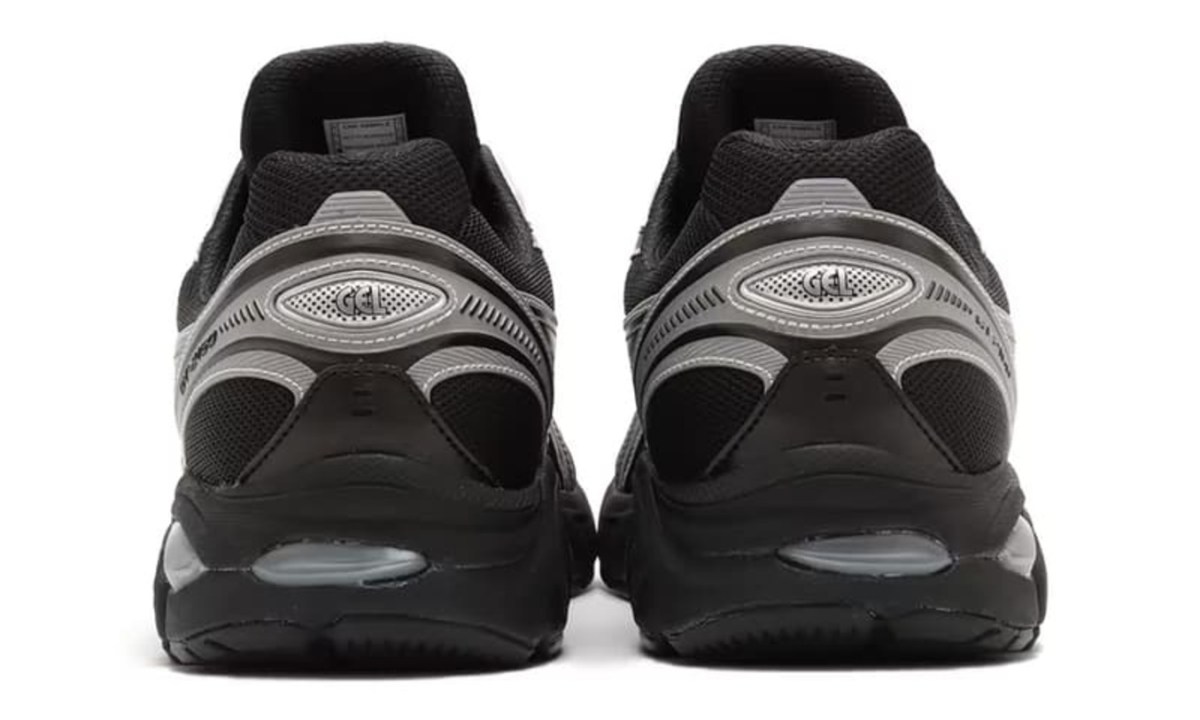 close up on heels of black and grey sneaker