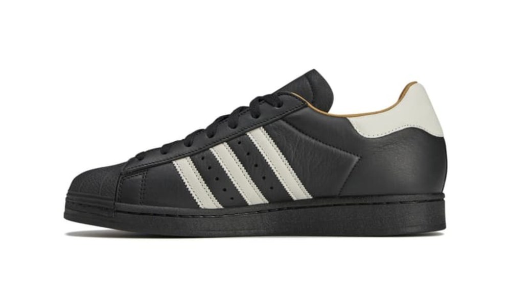 left side of black leather adidas superstar sneaker