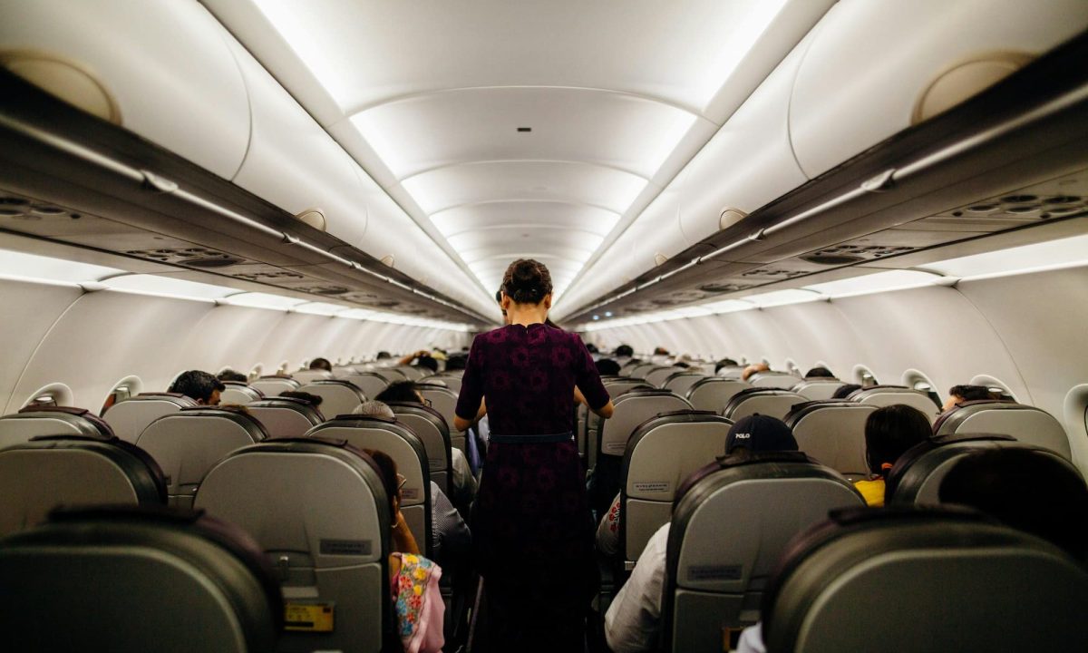 Person standing on an airplane
