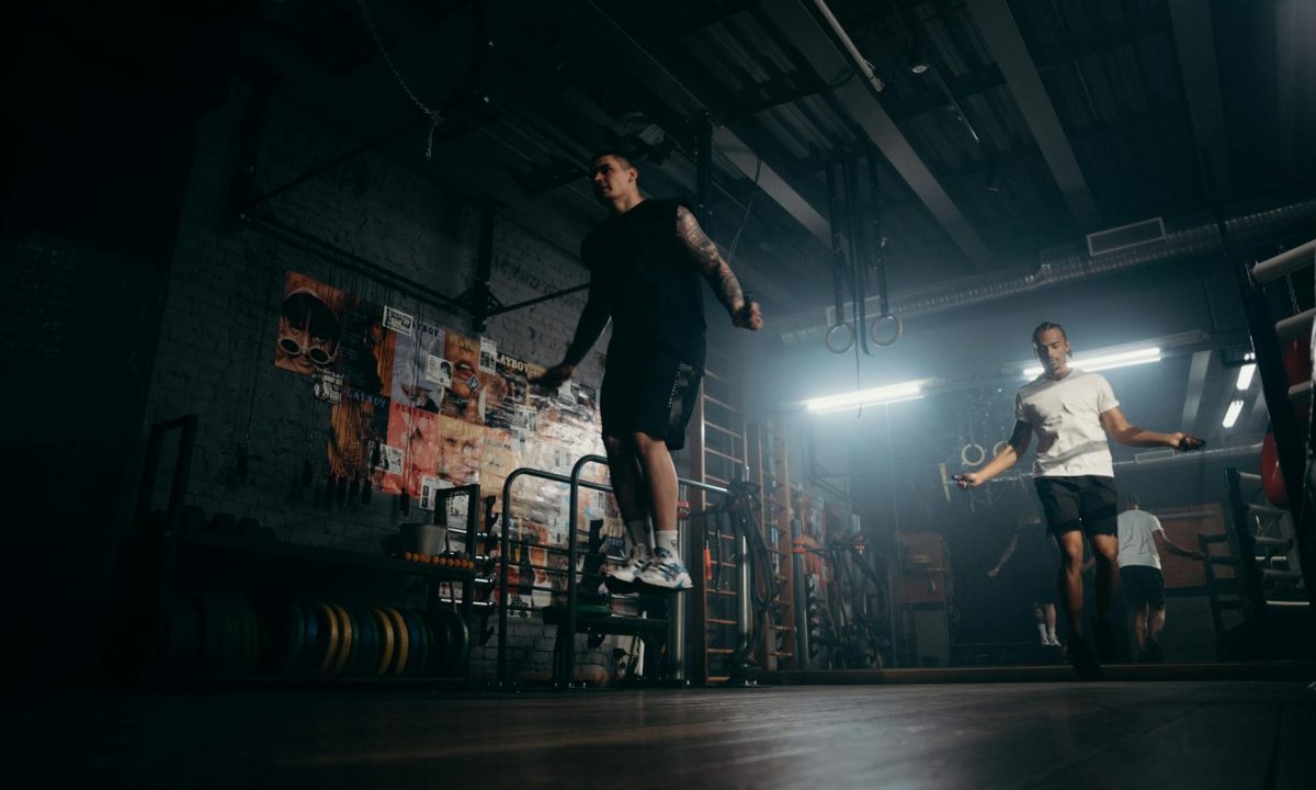 man jumping rope in gym jump rope aerobic cardio exercise