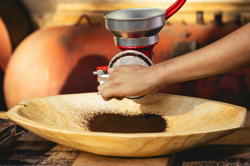 Pouring coffee grounds