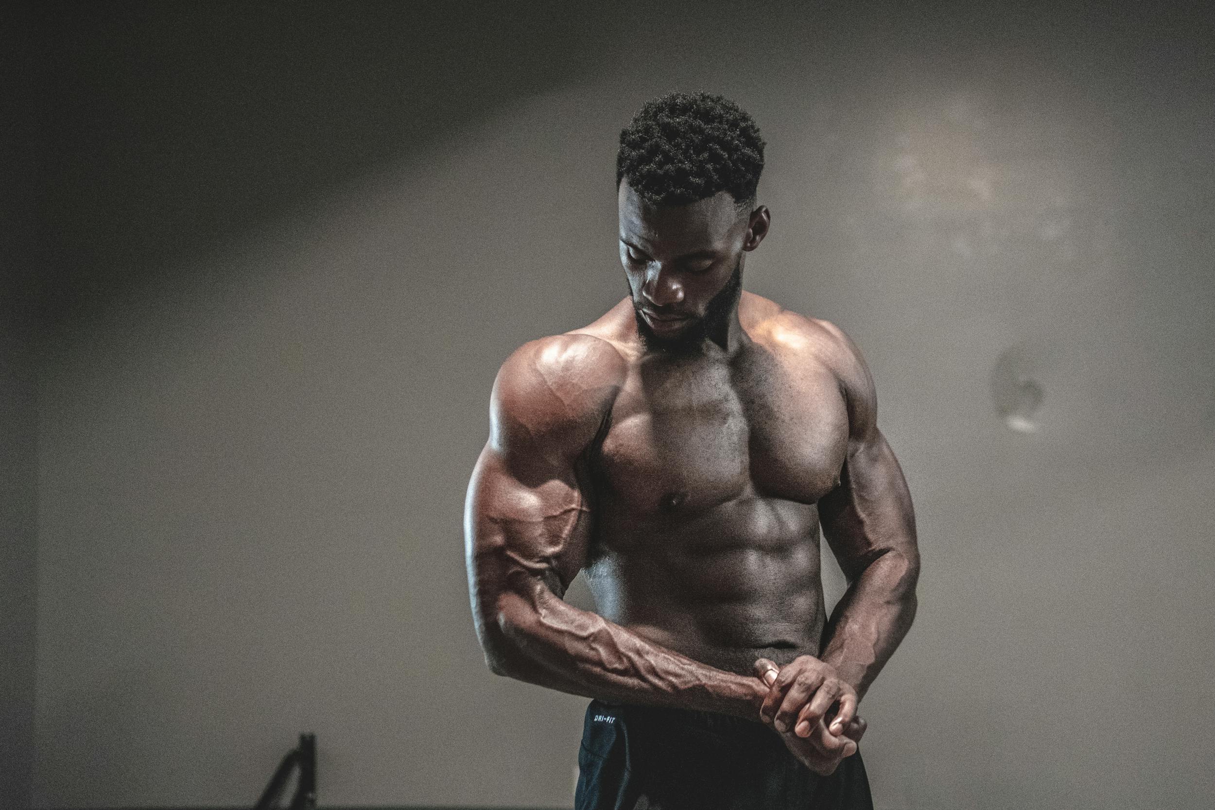 -man shirtless muscles flexing abs arms