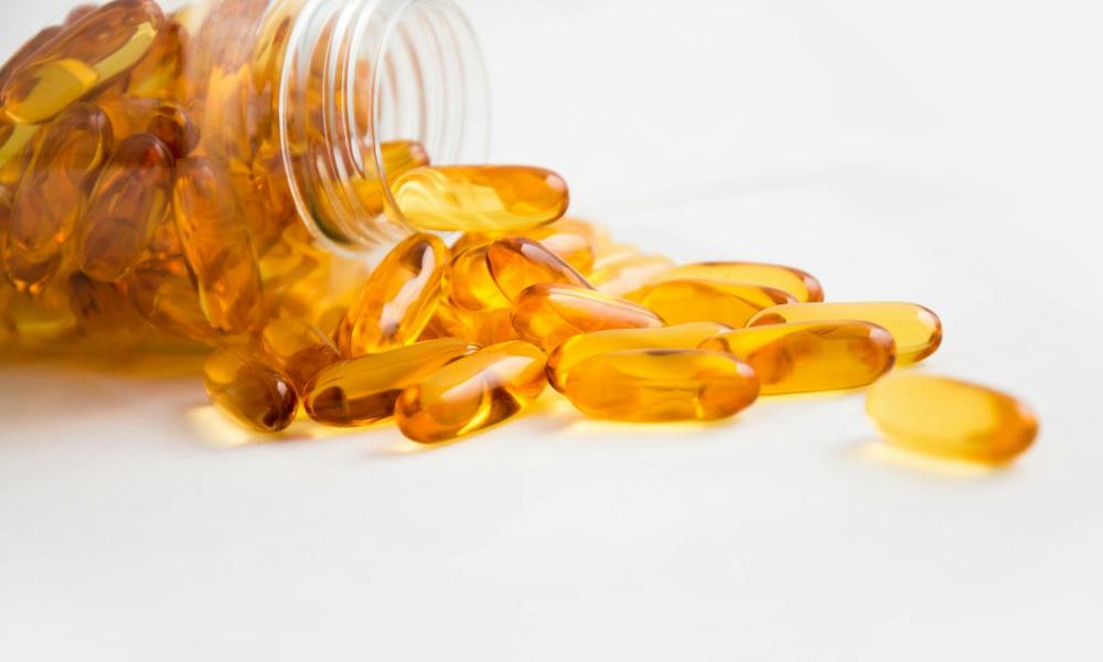 fish oil supplement in bottle on table