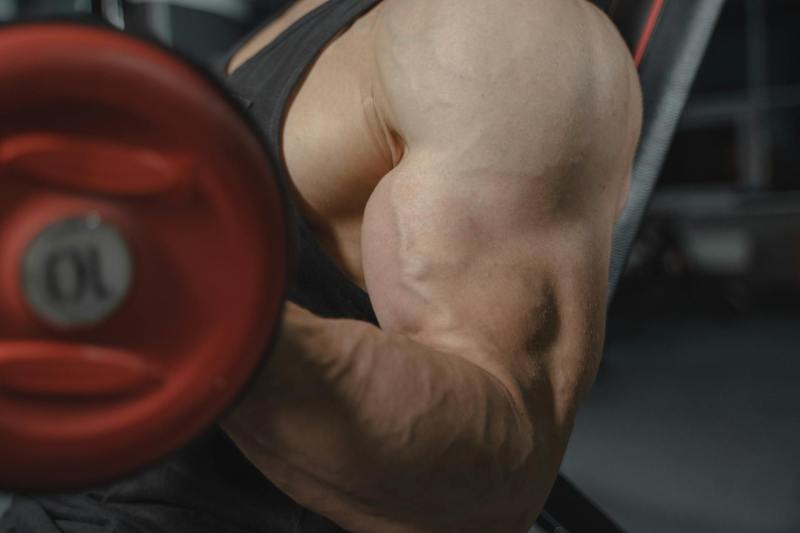 Close up biceps bicep curl one arm muscles muscular