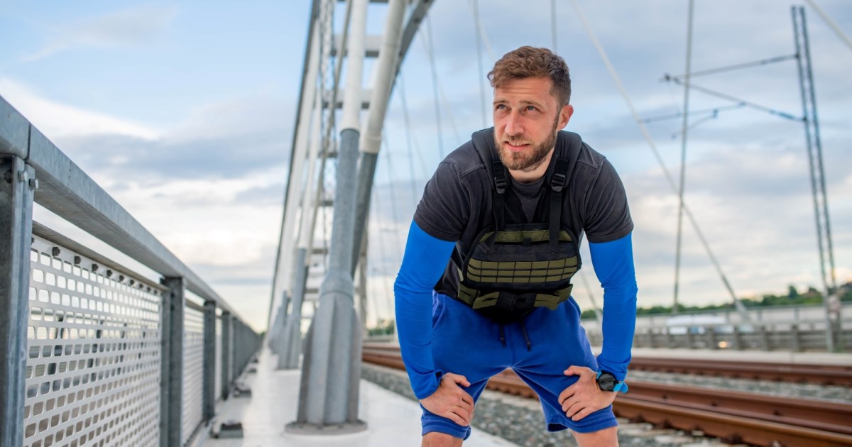 Man wearing a weighted vest outdoors