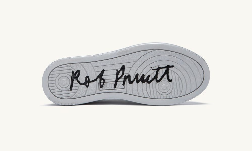 outside sole of silver shoe that reads Rob Pruitt
