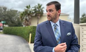 Man in Men's Wearhouse Blue Suit