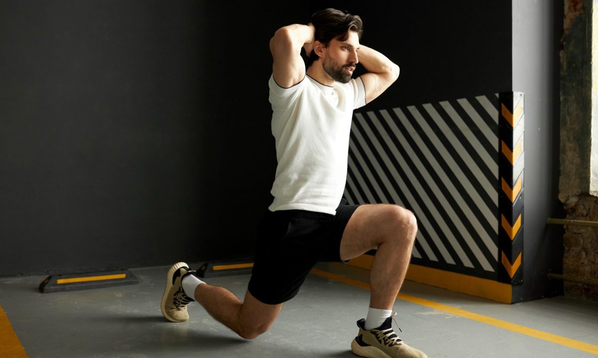 Man doing surrender squats exercise lunge position