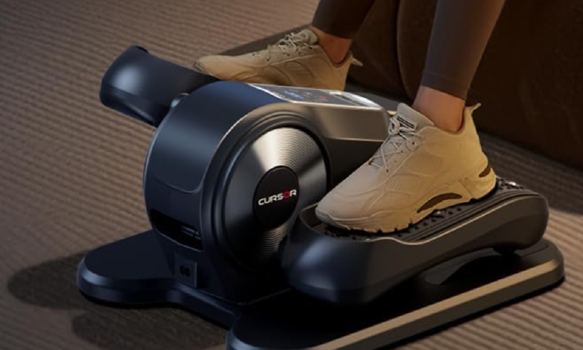A person using the Cursor Under Desk Elliptical Machine.