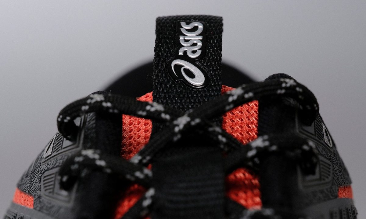 close up on pull tab of asics sneaker