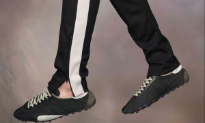 model wearing black retro running sneakers