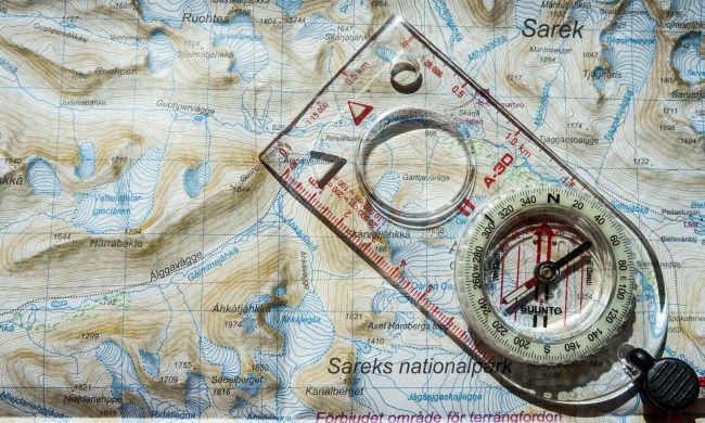 Baseplate compass on top of a map