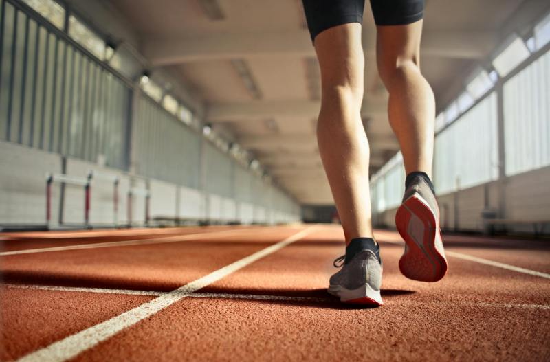 legs running on track.