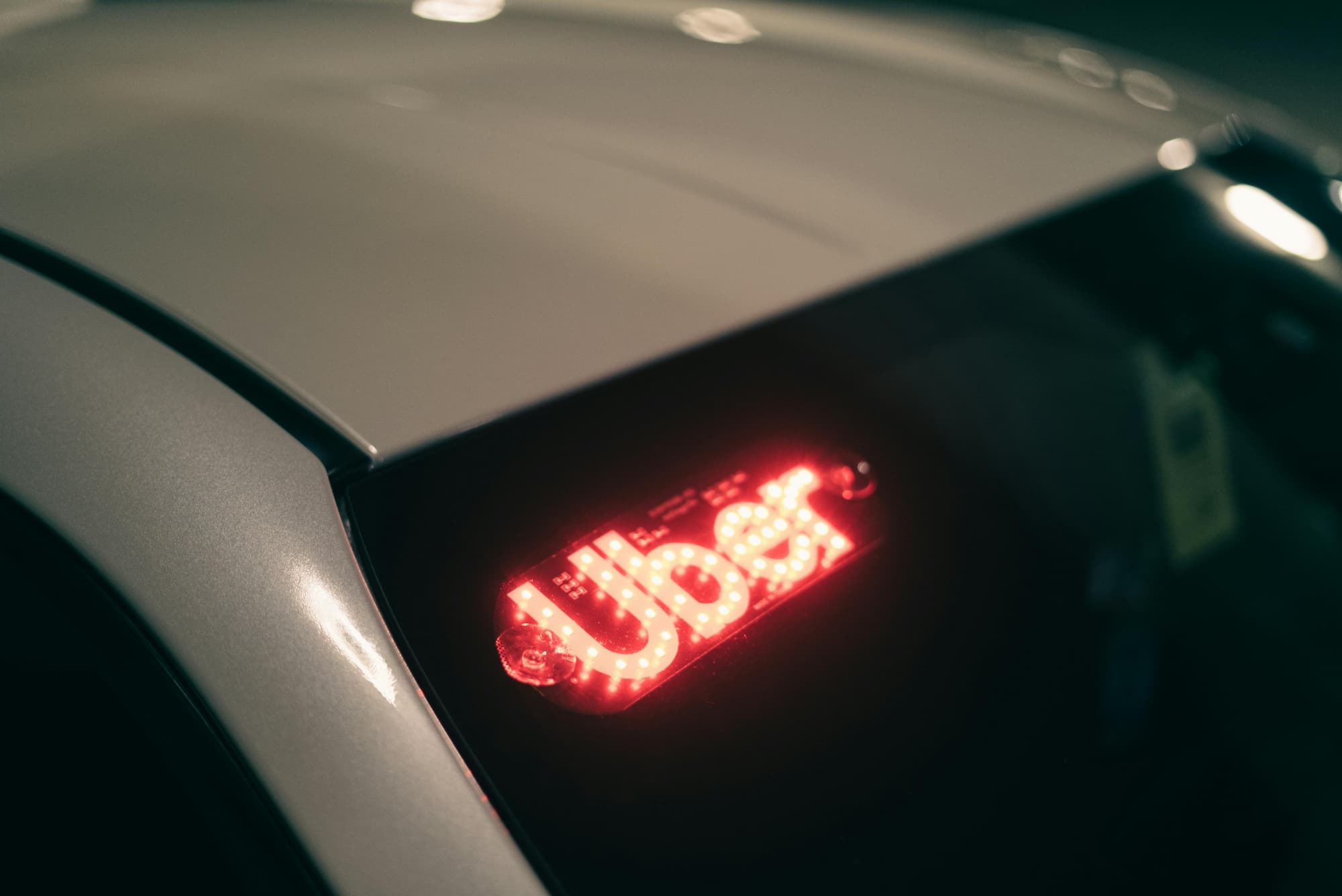 a car with the word "uber" on the windshield