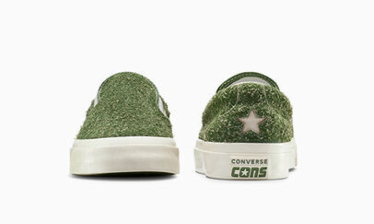 green hairy slip on converse