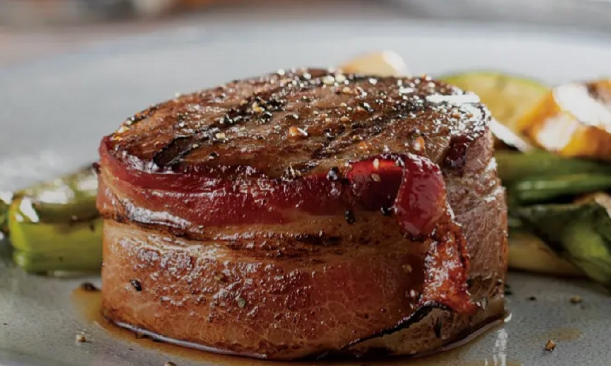 The Bacon-Wrapped Filet Mignon of Omaha Steak's Omaha Steaks Sampler on a plate.