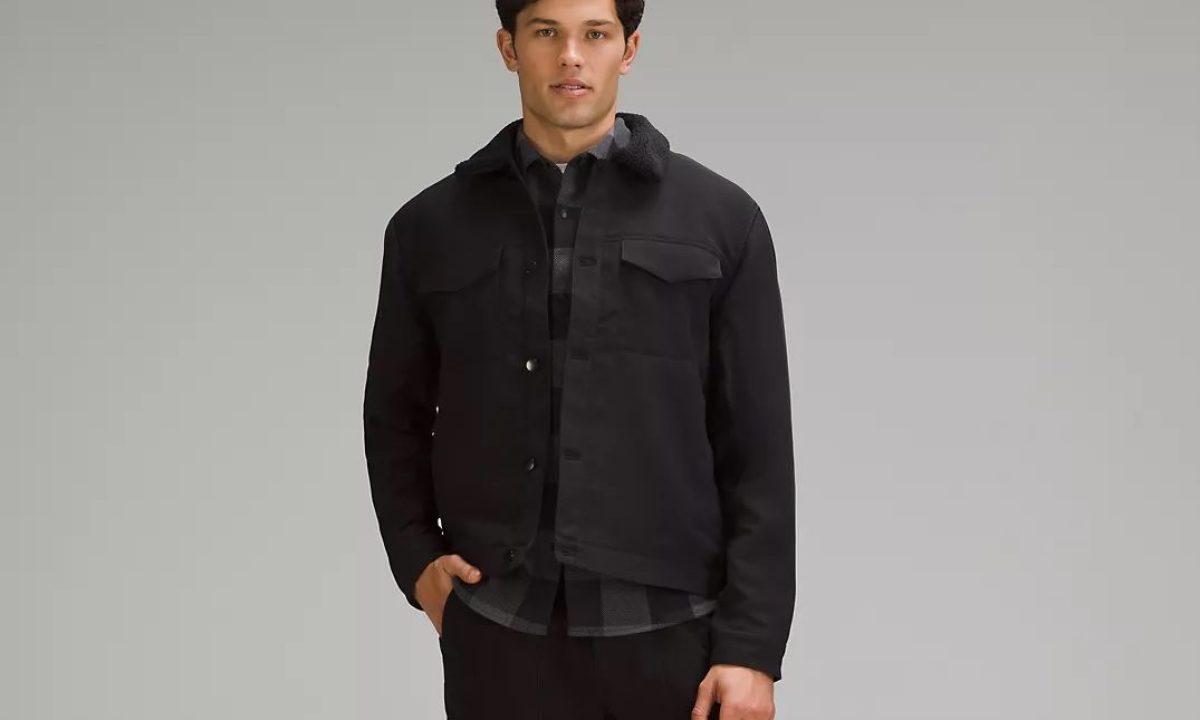 A man wearing the black version of Lululemon's Sueded Utility Jacket.