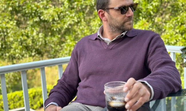Man in burgundy sweater polo