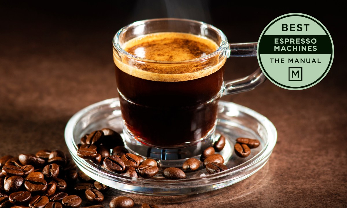 Cup of espresso with beans