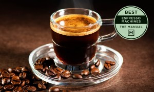 Cup of espresso with beans