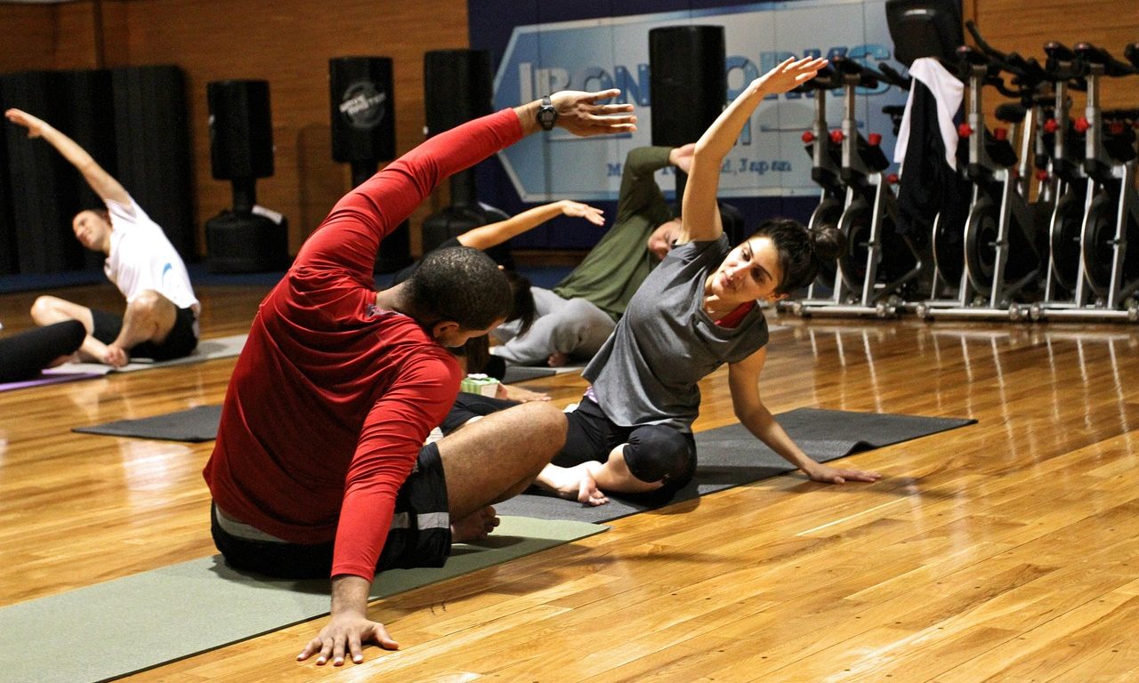 stretching yoga people in gym class
