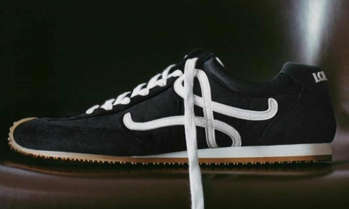 black loewe sneakers on chair