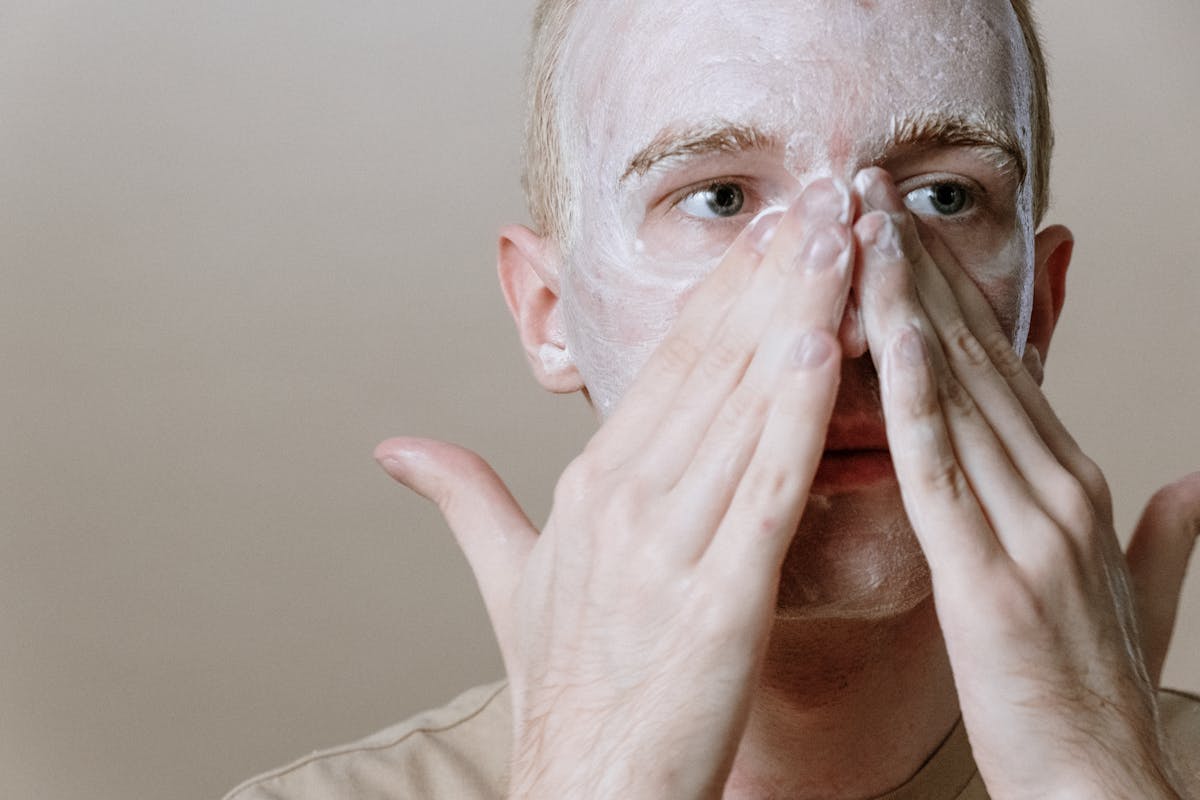 Man applying skincare products