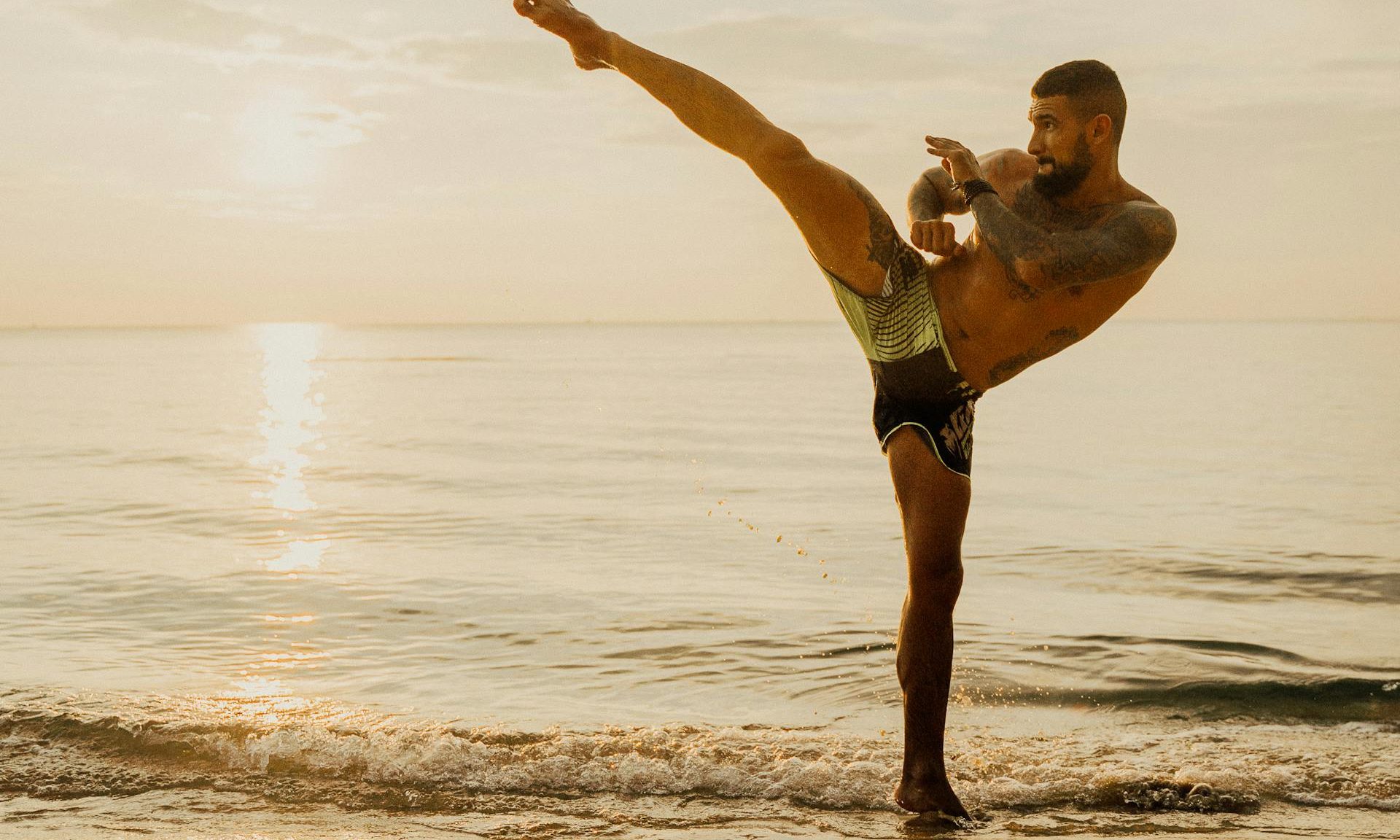 Kickboxing exercise on the Sunset Training of the beach